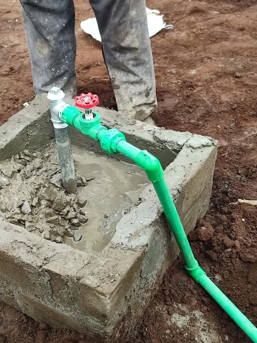 Close-up of a gas valve and inlet pipe fitting