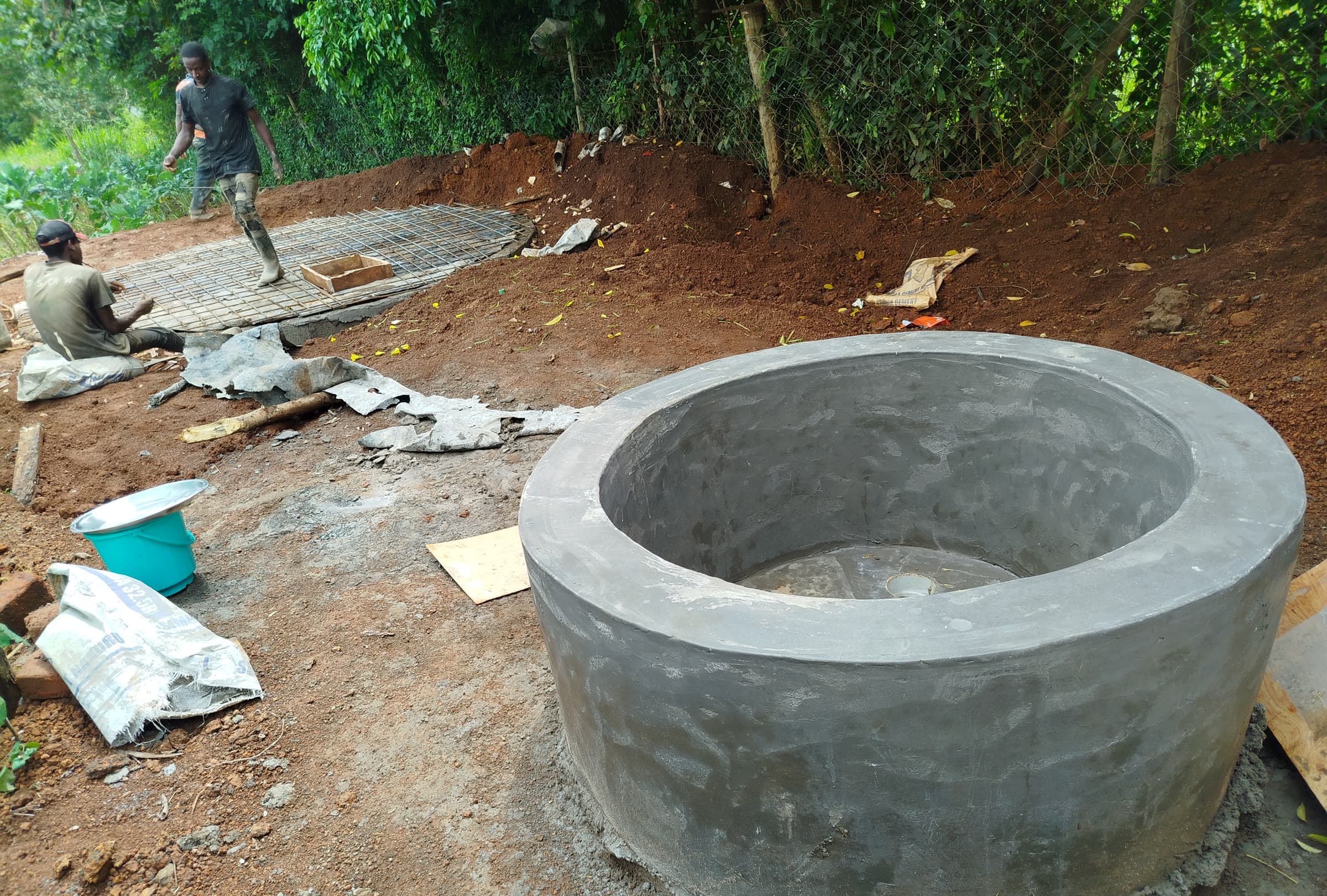 Greenleaf technicians constructing a biogas digester on site in Kenya