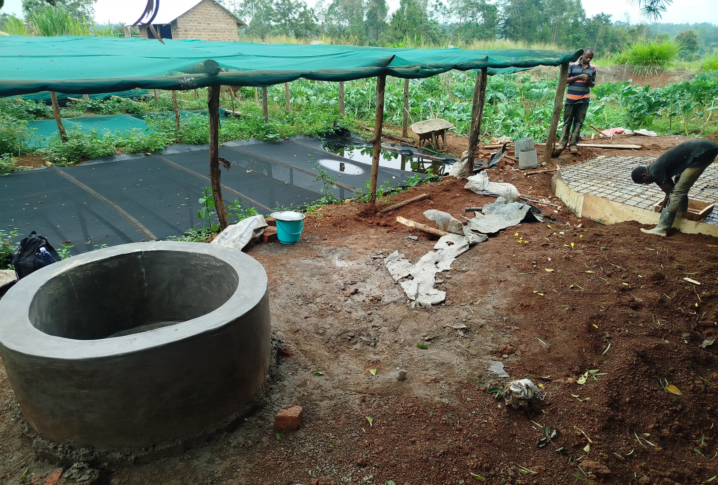 A completed biogas digester integrated into a working Kenyan farm